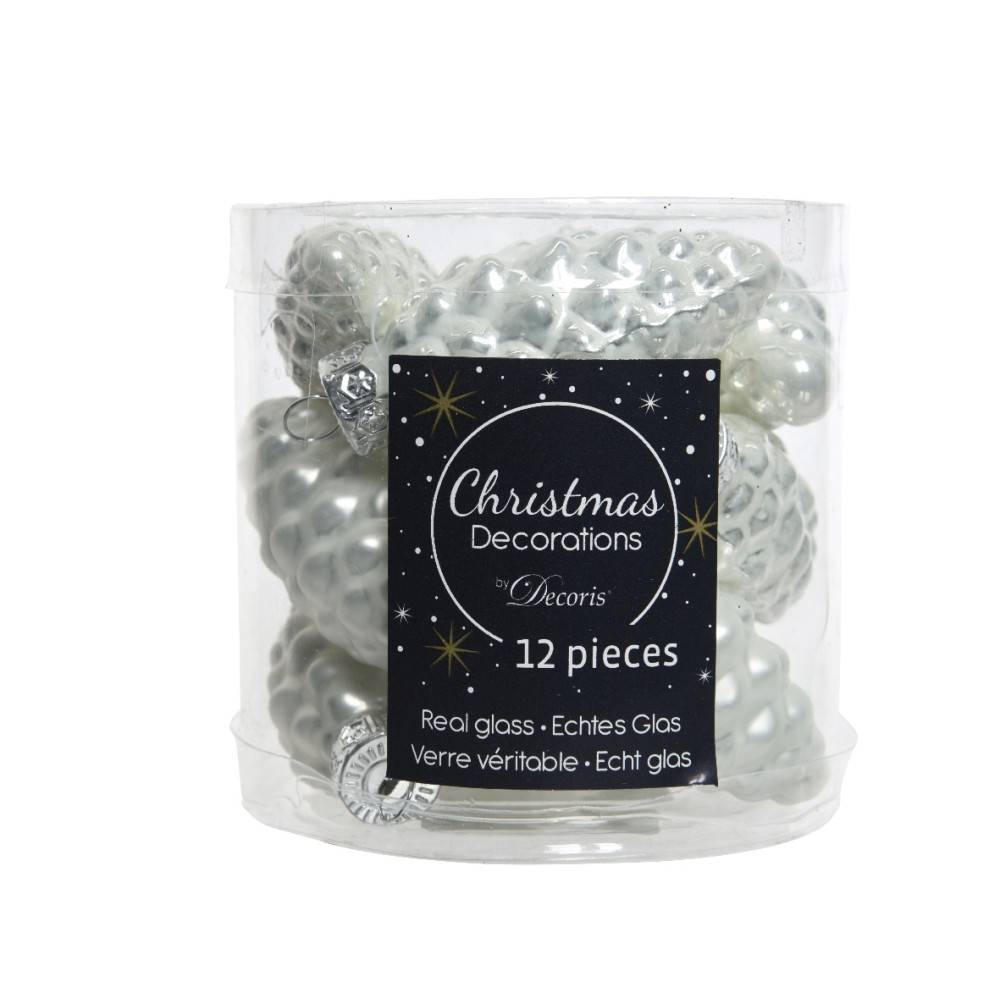 A clear container filled with white glass Christmas ornaments shaped like pine cones.