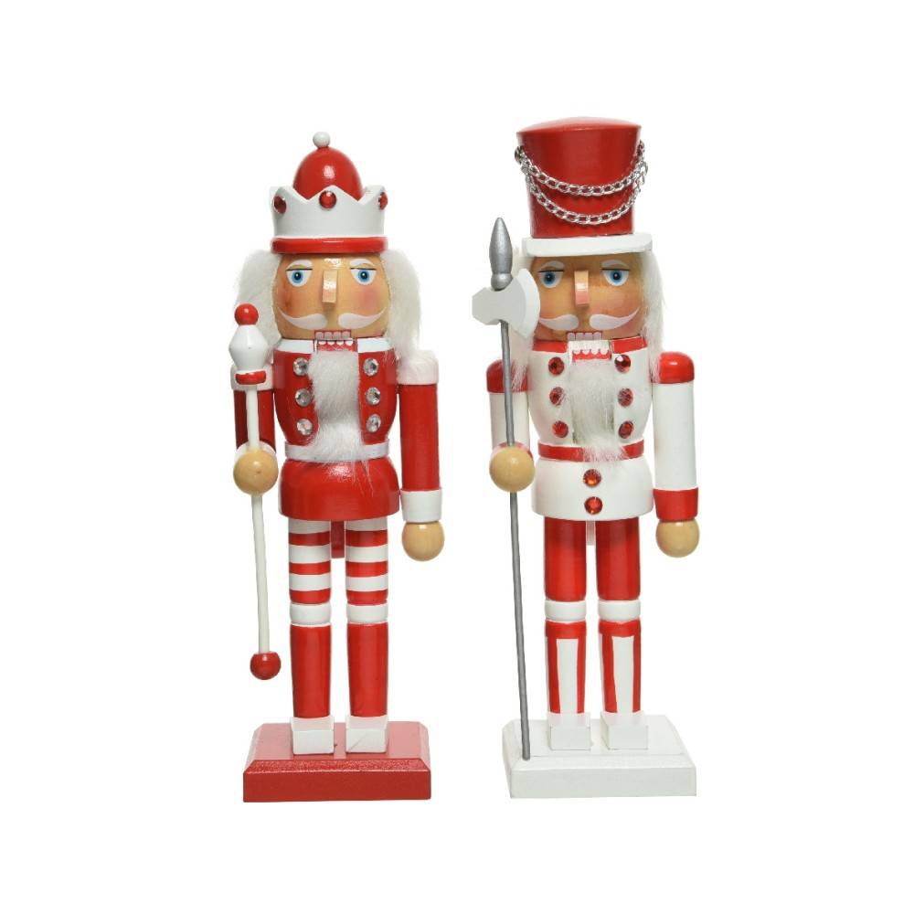 Two colorful nutcracker figures dressed in red and white, one with a crown and the other with a s...