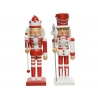 Two colorful nutcracker figures dressed in red and white, one with a crown and the other with a s...