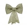 A shimmering gold bow with a textured fabric and trailing ribbon ends.