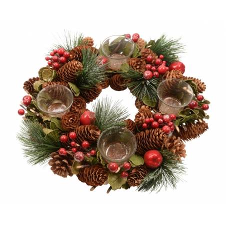 A festive wreath of pinecones, greenery, and red berries with four glass candle holders.