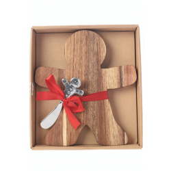 A wooden gingerbread man with a silver spoon, tied with a red ribbon in a box.