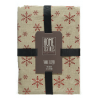 A beige tablecloth adorned with red snowflakes, neatly packaged with a black ribbon.