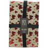 A festive table runner with red Christmas trees on a light beige background.