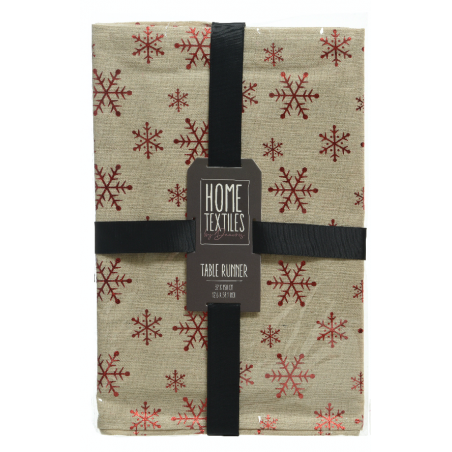 A beige table runner adorned with red snowflakes, neatly packaged with a black ribbon.
