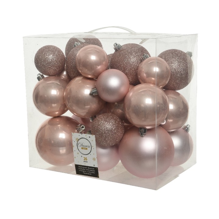 Een doorzichtige doos vol glanzende en sprankelende rosegouden kerstballen in diverse maten.