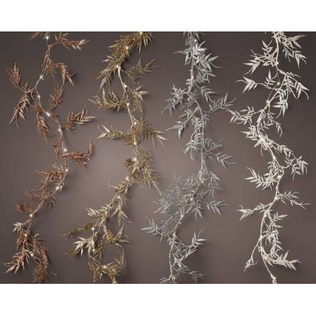 Four decorative garlands in gold, silver, and white, featuring intricate leaf designs. Four decorative garlands in gold, silver, and white, featuring intricate leaf designs.