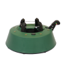 A green Christmas tree stand with a circular base and a black clamp for securing the tree.