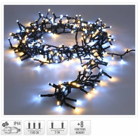 A tangled string of blue and warm white fairy lights on a dark background.