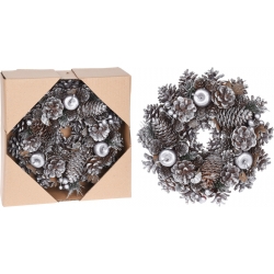 A circular wreath adorned with silver-painted pinecones and frosted leaves, nestled in a box.