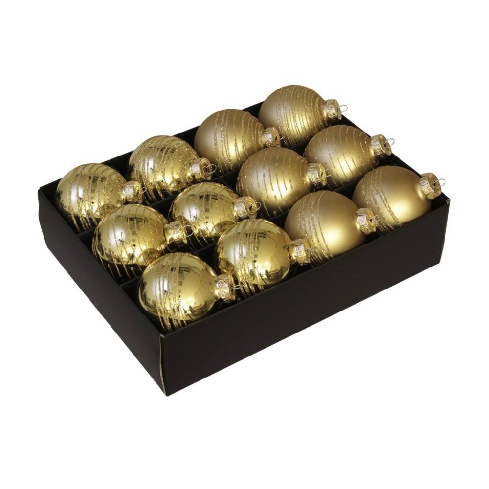 Een zwarte doos met twaalf glanzende gouden kerstballen in verschillende tinten.
