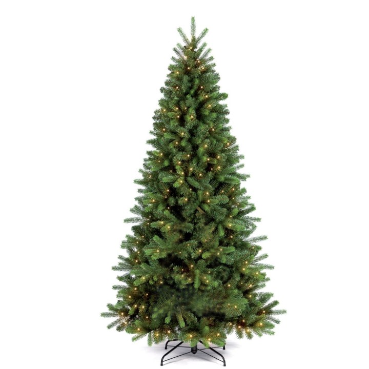 Groene kunstkerstboom met een volle vorm, versierd met sprankelende lichtjes.
