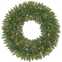 A lush green wreath adorned with twinkling white lights, creating a festive ambiance.