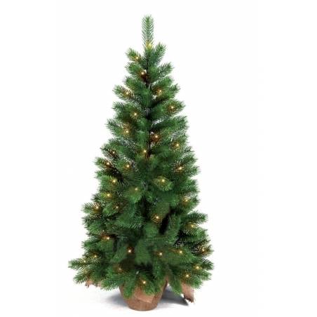 A lush green artificial Christmas tree adorned with warm twinkling lights. A lush green artificial Christmas tree adorned with warm twinkling lights.