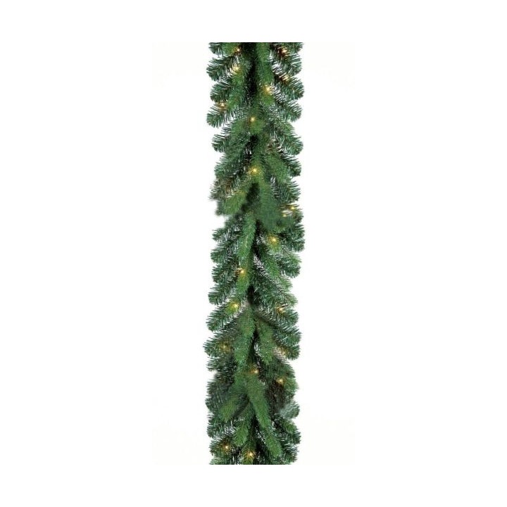 Groene kerstguirlande met takken en kleine sfeervolle lampjes.