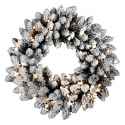 Verlichte kerstkrans met sneeuw