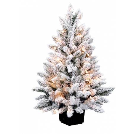 A frosted artificial Christmas tree adorned with warm white lights.