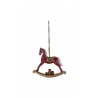 A vintage-style red rocking horse with a detailed mane and saddle, suspended by a rope.