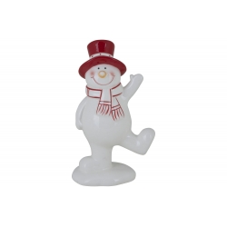 A cheerful white snowman figurine with a red hat and scarf, waving happily.