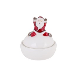A white ceramic container topped with a cheerful Santa Claus figure in red and gray.
