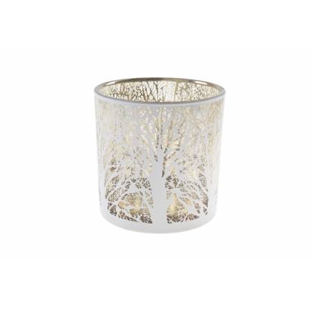A delicate white candle holder with intricate tree designs and a reflective gold interior.