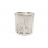 A delicate white candle holder with intricate tree designs and a reflective gold interior.