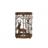 A rustic candle holder with deer silhouettes amidst tree designs, blending metal and glass.
