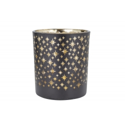 A black candle holder adorned with golden star patterns, creating a shimmering effect.