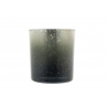 A cylindrical glass candle holder with a gradient from dark gray to clear, speckled surface.