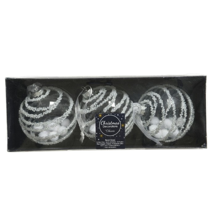 Drie glazen kerstballen in een zwarte doos, versierd met witte glitters en strikjes.