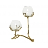 A stylish candle holder with two glass bowls supported by a branching, gold-toned base.