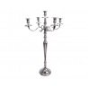A tall, shiny silver candelabra with five gracefully curved arms and a sleek base.