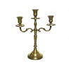 A vintage brass candlestick holder with three elegant arms and a polished finish.