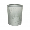 A frosted glass candle holder featuring a snowy forest scene with tall pine trees.