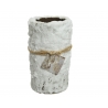 A textured white vase resembling tree bark, tied with twine and a small tag.
