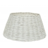 A wide, conical white wicker basket with a textured, woven surface.