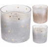Three shimmering glass candle holders with gold star patterns and a gradient from silver to rose.