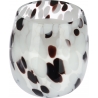 A translucent glass vessel with a speckled pattern of black and white dots.