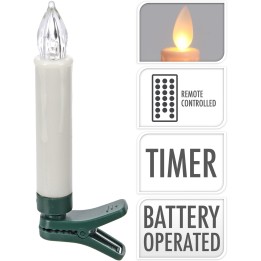 Een witte kaars met een groene klem, LED-vlam en afstandsbediening, op batterij.