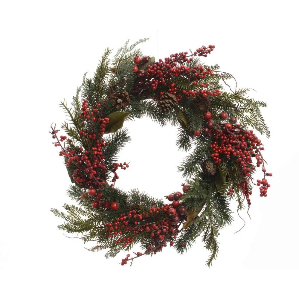 A circular wreath adorned with evergreen leaves, red berries, and pine cones.