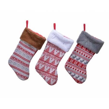 Three festive Christmas stockings with winter patterns and soft, cozy cuffs.