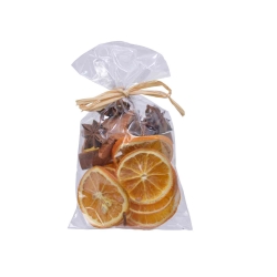 A clear bag filled with dried orange slices and aromatic spices tied with a natural twine.