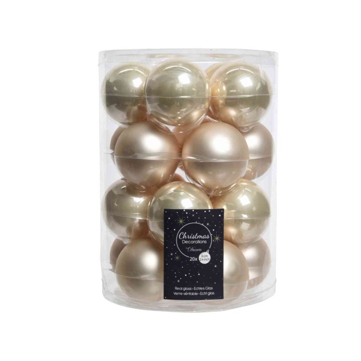 Een doorzichtige cilinder met 20 glanzende, gouden en parelmoer kerstballen.
