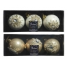 Elegant Christmas ornaments in white and gold, adorned with sparkling designs, packaged neatly.