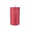 A tall, cylindrical candle in a vibrant red hue with a textured surface.