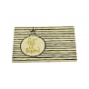 A beige doormat featuring a black-striped design and a gold ornament with "let it snow" text.