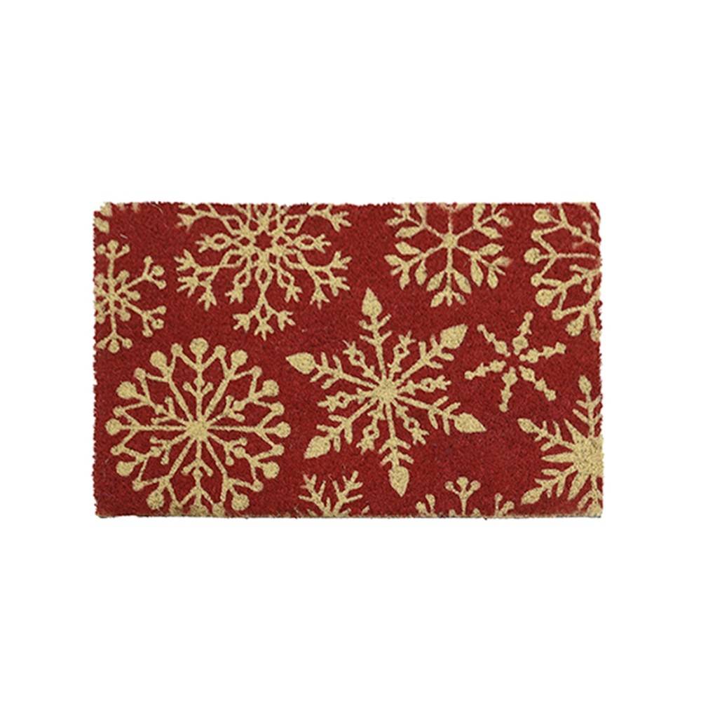 A festive red mat adorned with golden snowflake patterns.