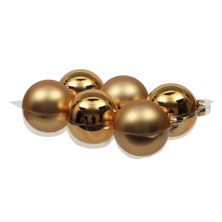 Zes glanzende gouden ballen in een moderne, elegante opstelling.