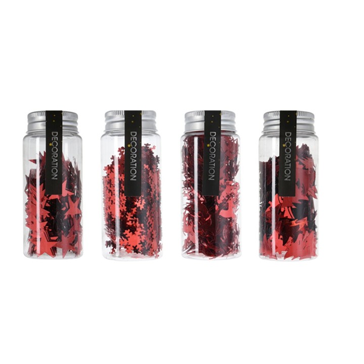 Vier doorzichtige potjes met rode decoratieve confetti in diverse vormen en maten.
