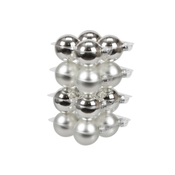 A stack of shiny silver ornament balls in a clear plastic tray.